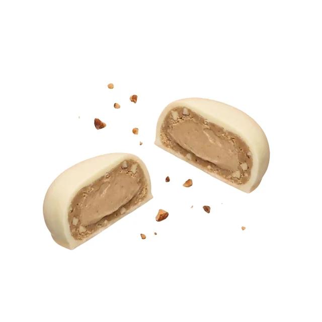 Praliné de chocolate blanco como referencia visual de la nota gourmand.